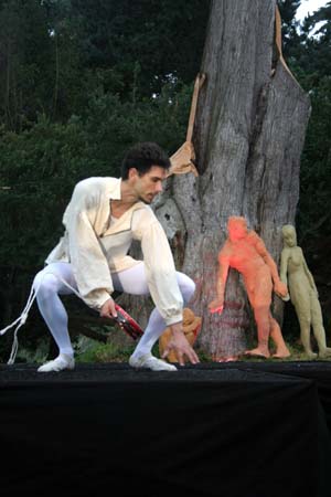 Tom bending close to the ground